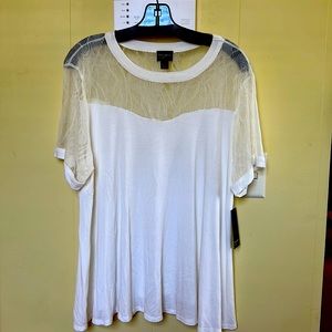 Cream short sleeved blouse with intricate lace top.